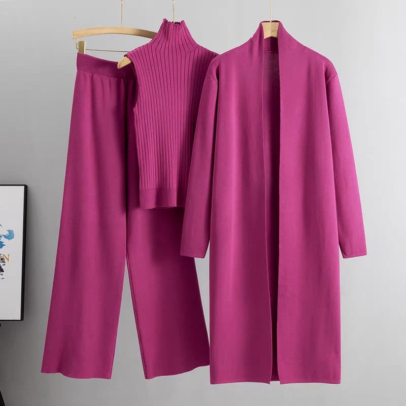 Magenta 3-piece knit co-ord set laid flat showing ribbed top, pants, and longline cardigan