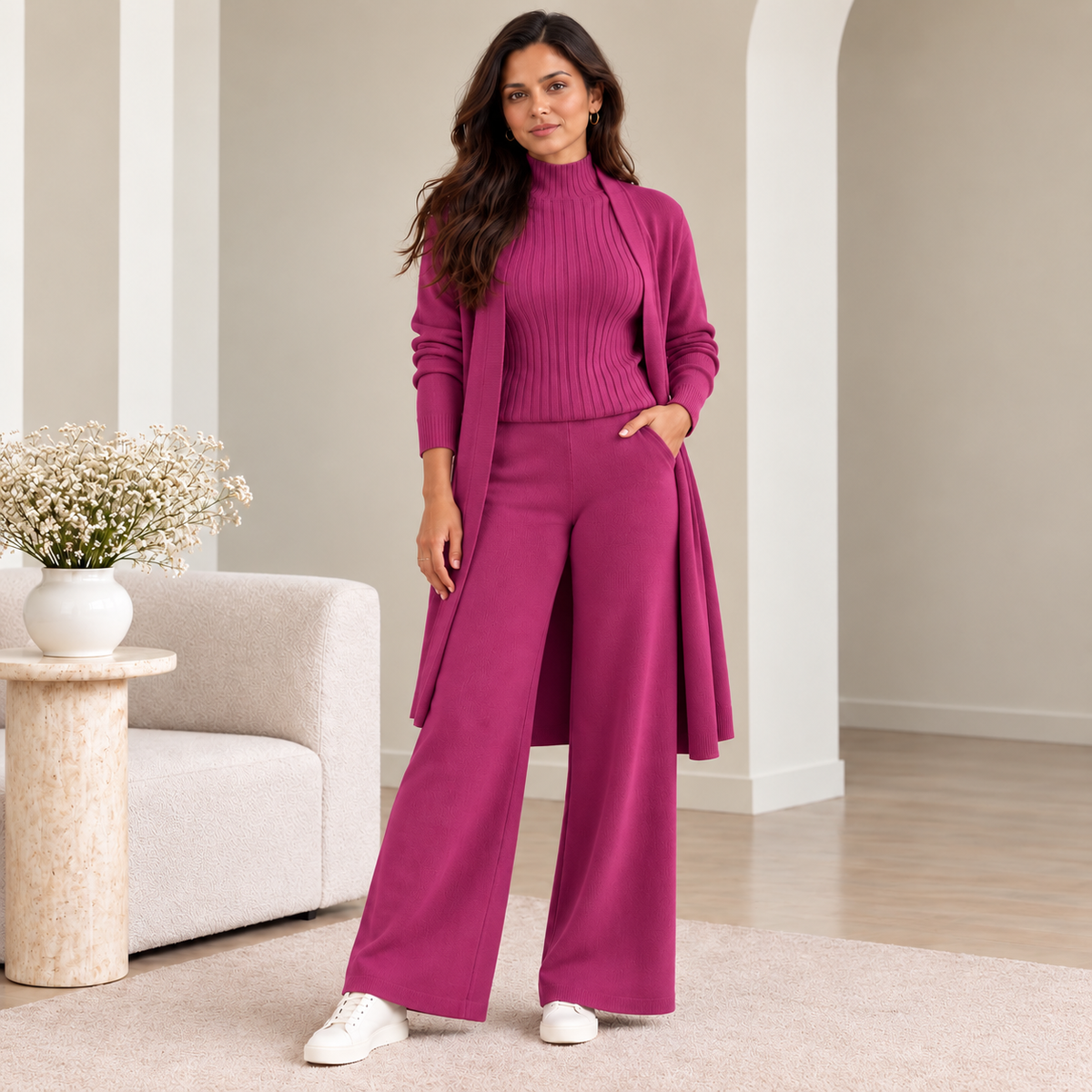 Woman wearing magenta 3-piece knit co-ord set with longline cardigan and ribbed top