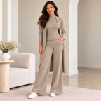 Woman wearing taupe 3-piece knit co-ord set with longline cardigan and wide-leg pants