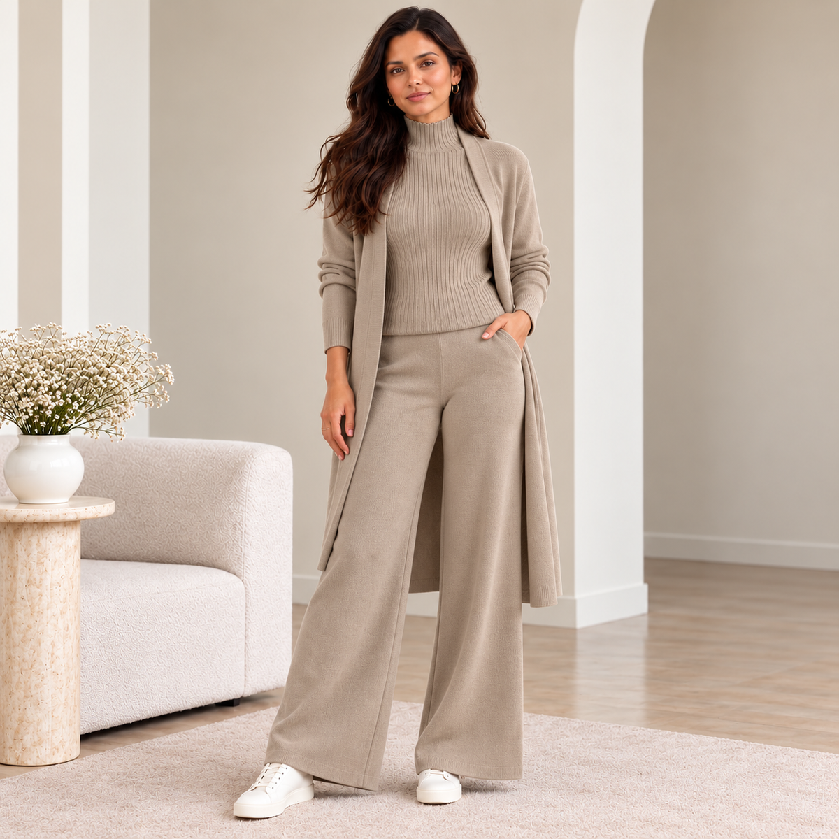 Woman wearing taupe 3-piece knit co-ord set with longline cardigan and wide-leg pants