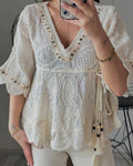 Close-up of Marisol Boho Embroidered Top V-neckline with beaded trim