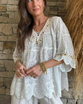 Woman wearing Marisol Boho Embroidered Top with bell sleeves