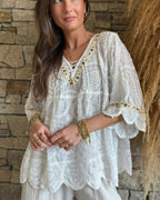 Woman wearing Marisol Boho Embroidered Top with bell sleeves