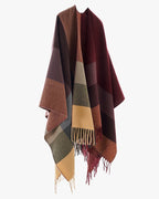 The Merlot Mosaic Cashmere Cape worn open-front showing full merlot mosaic geometric print on deep wine red faux cashmere in structured cape silhouette
