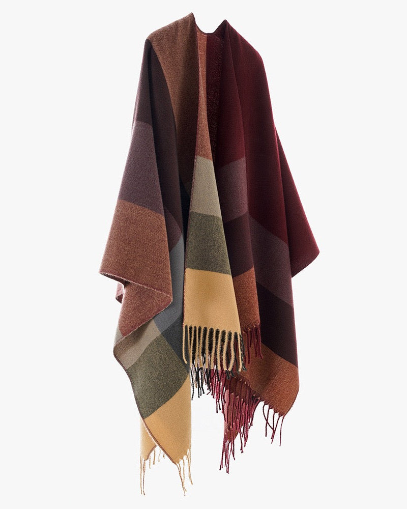 The Merlot Mosaic Cashmere Cape worn open-front showing full merlot mosaic geometric print on deep wine red faux cashmere in structured cape silhouette
