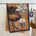 Midnight Amber Black Shawl laid flat showing full botanical print in amber and gold tones across deep black faux cashmere fabric
