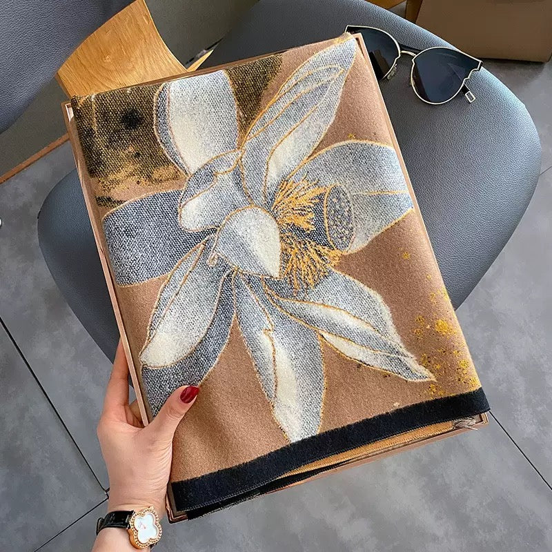 Midnight Amber Black Shawl wrapped around neck showing black and amber gold botanical print and soft faux cashmere drape
