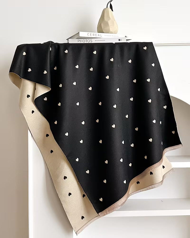 The Midnight Hearts Cashmere Wrap laid flat displaying full midnight dark heart motif print pattern on soft faux cashmere base
