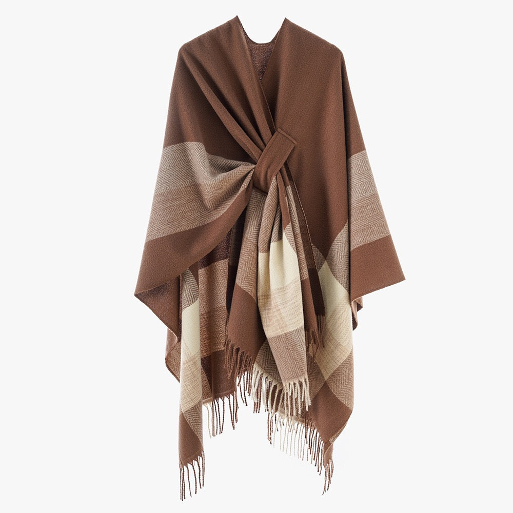 The Mocha Herringbone Cashmere Cape draped over shoulders in cape style showing warm mocha herringbone pattern and full-coverage silhouette
