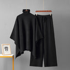 Black turtleneck poncho knit co-ord set laid flat showing top and wide-leg pants