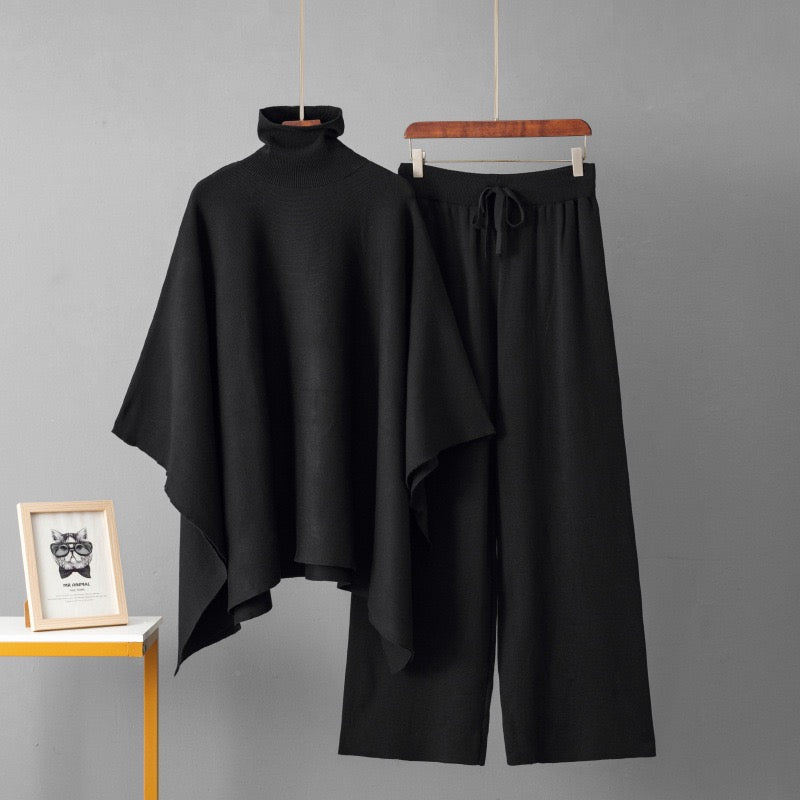 Black turtleneck poncho knit co-ord set laid flat showing top and wide-leg pants