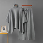 Grey turtleneck poncho knit co-ord set laid flat showing top and wide-leg pants