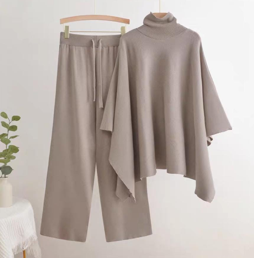 Taupe turtleneck poncho knit co-ord set laid flat showing top and wide-leg pants