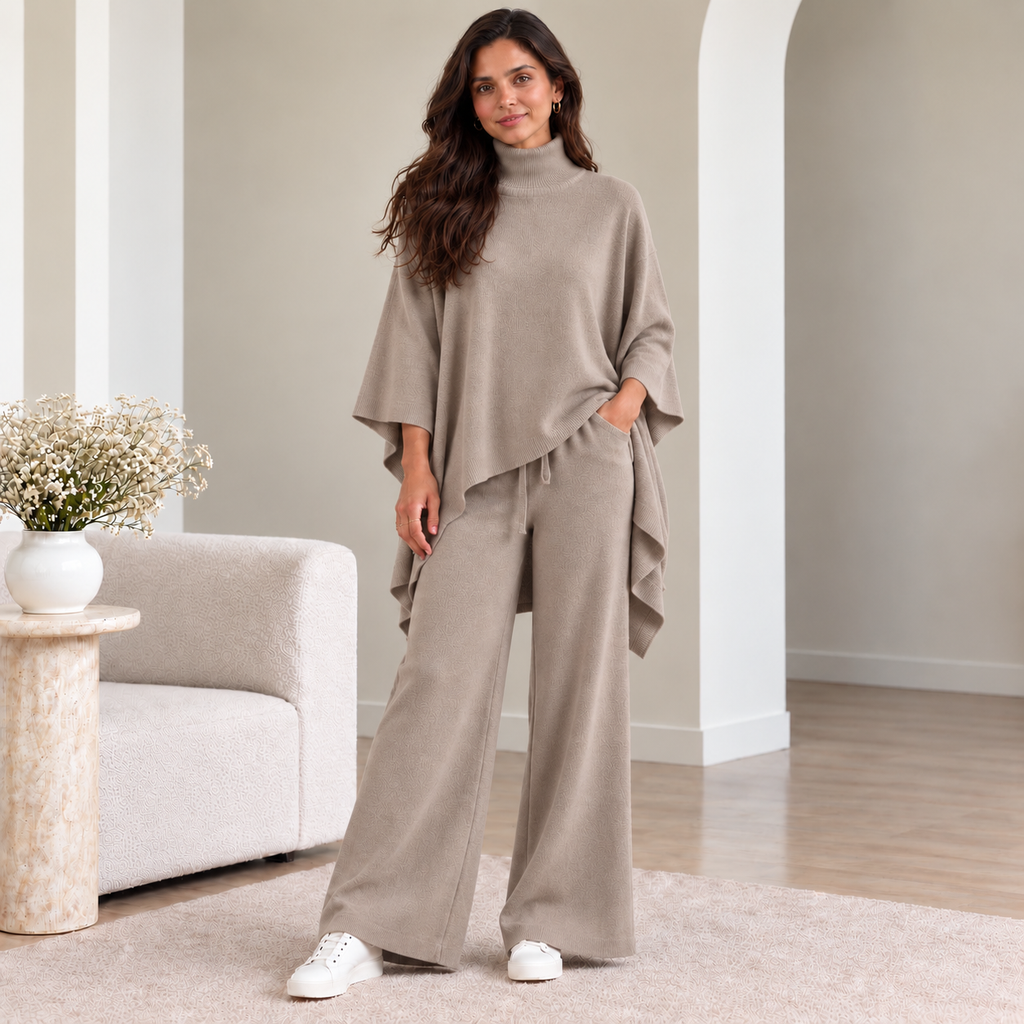 Woman wearing taupe turtleneck poncho knit co-ord set with wide-leg pants
