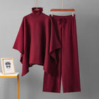 Wine turtleneck poncho knit co-ord set laid flat showing top and wide-leg pants