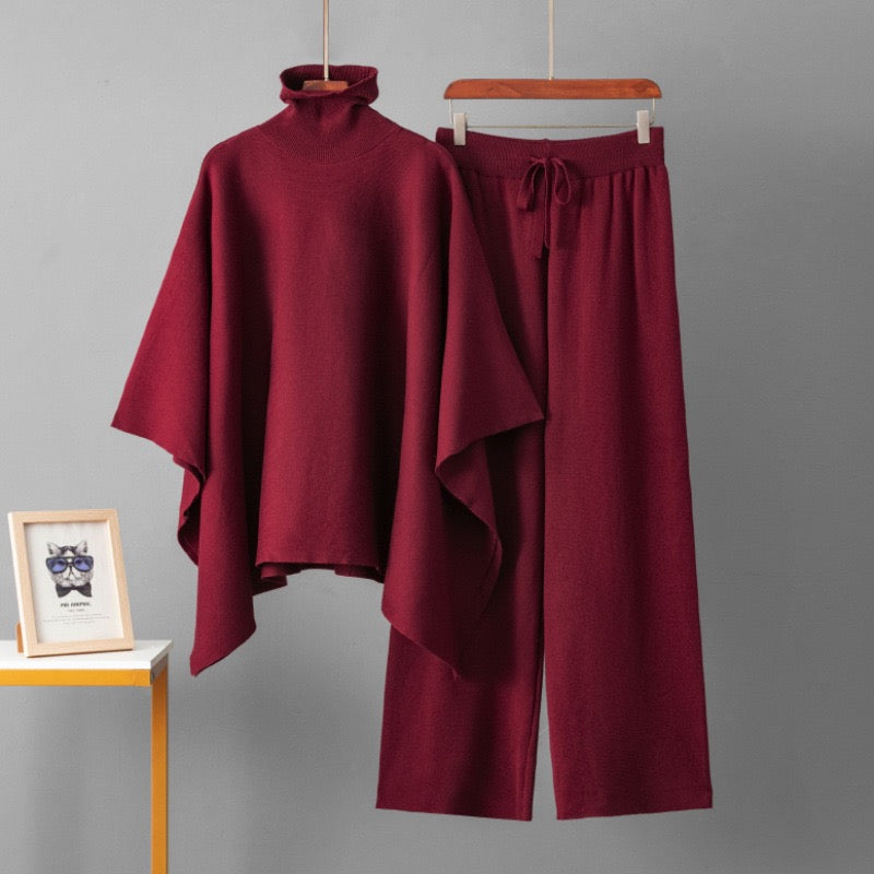 Wine turtleneck poncho knit co-ord set laid flat showing top and wide-leg pants