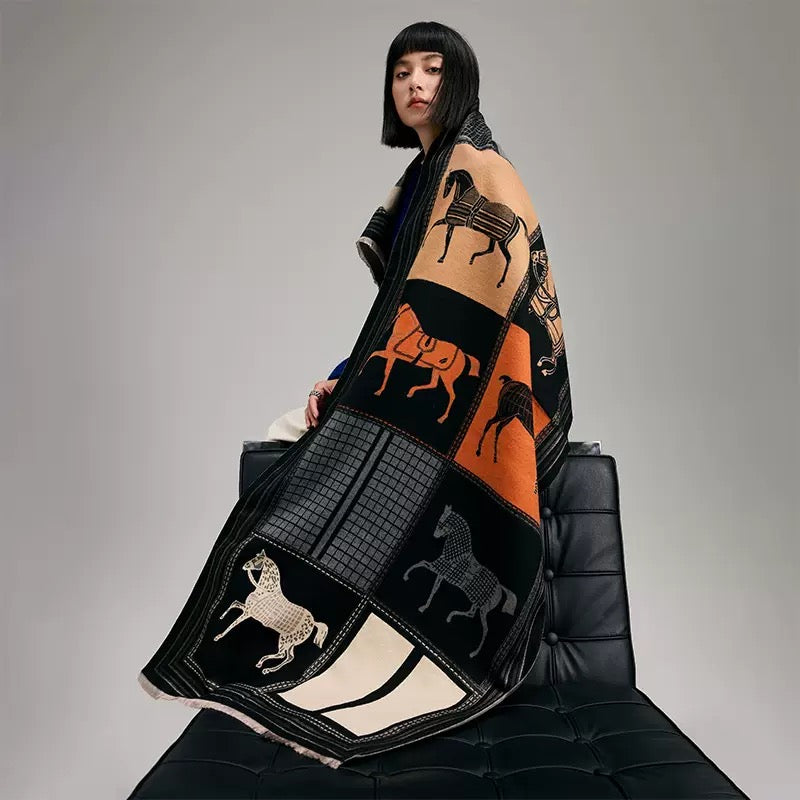 The Noir Equestrian Cashmere Wrap draped and styled showing equestrian heritage print on noir faux cashmere base


