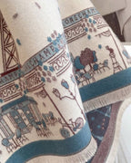 Close-up of The Parisian Postcard Reversible Wrap showing soft faux cashmere fabric texture with detailed vintage Parisian postcard illustrated print
