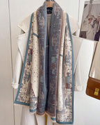 The Parisian Postcard Reversible Wrap showing primary side with vintage French-inspired illustrated postcard motif on soft faux cashmere fabric
