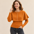 Caramel orange Pearl Elegance cape knit sweater with pearl neckline detailing, cape overlay and ribbed sleeves.
