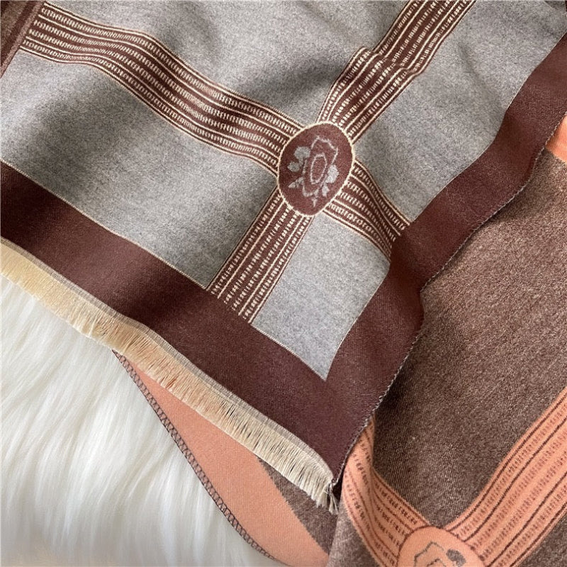 Close-up of The Polo Heritage Winter Stole showing soft faux cashmere fabric texture with detailed heritage polo equestrian print in navy cream and camel tones
