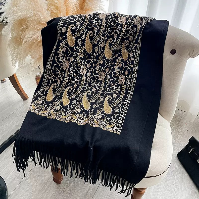 Regal Noir Embroidered Winter Stole laid flat showing full gold and beige paisley floral embroidery pattern with fringe edge on black fabric
