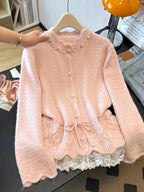 Blush pink women's knit cardigan with pearl embellishments, tie waist and white lace-trimmed hem