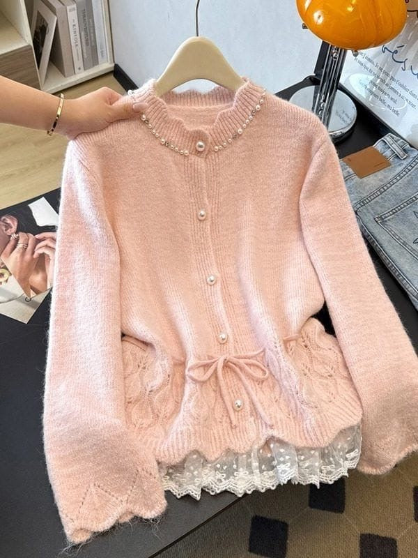 Blush pink women's knit cardigan with pearl embellishments, tie waist and white lace-trimmed hem