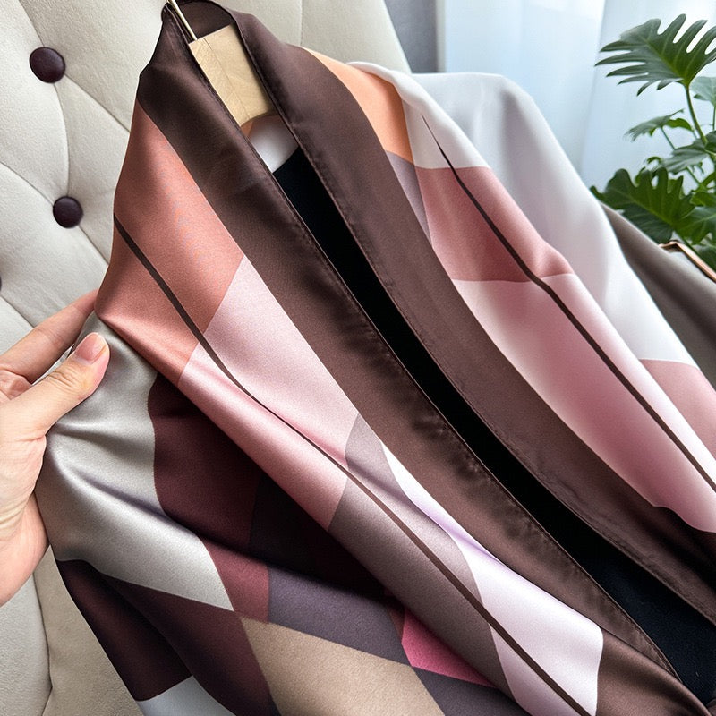 Close-up of the Rosewood Abstract Geometric Silk Stole highlighting its smooth silk texture and geometric print.