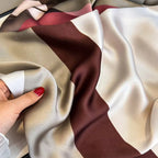 Close-up of the Rosewood Abstract Geometric Silk Stole showing its luxurious silky fabric and soft drape.