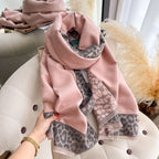 Rosewood Leopard Trim Wrap wrapped around shoulders showing leopard print border and fringe detail