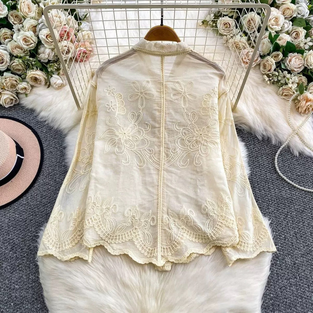 Back view of Seraphine Cutwork Cotton Shirt in ivory showing embroidered yoke and scalloped hem detail
