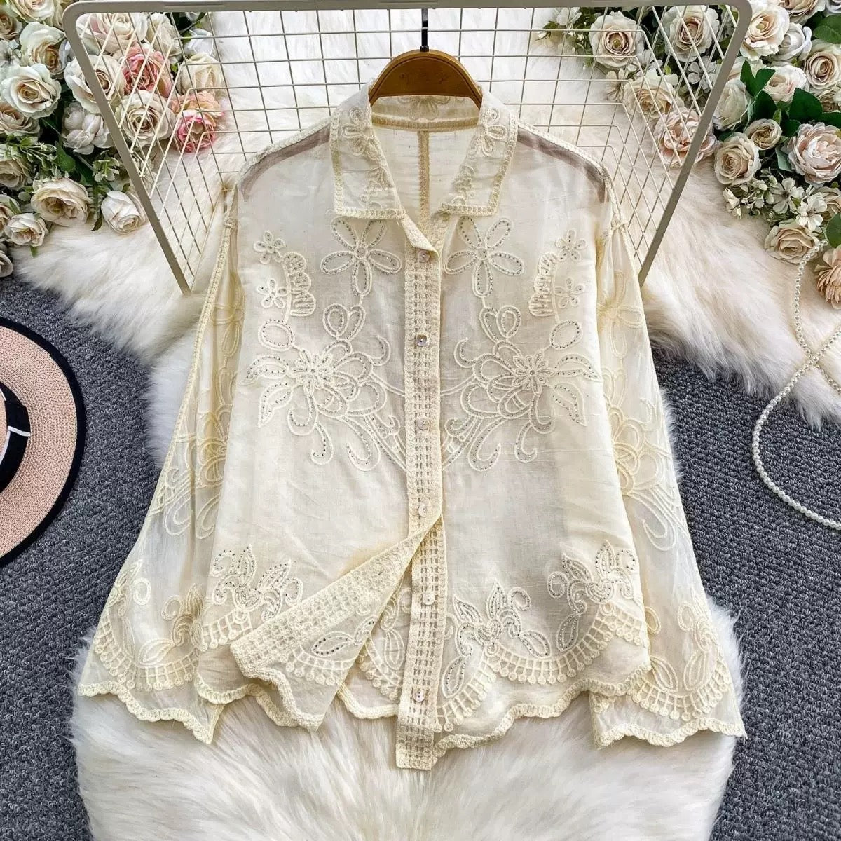 Seraphine Cutwork Cotton Shirt in ivory displayed on hanger showing full cutwork embroidery and lace placket