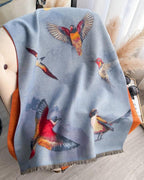The Skybound Aviary Reversible Wrap laid flat showing both reversible sides with bird and botanical aviary print in contrasting color tones
