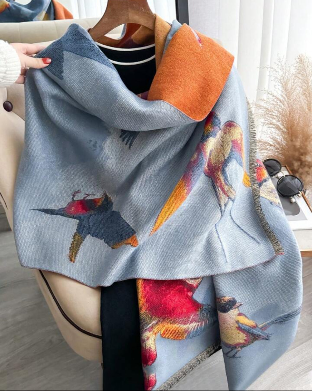 The Skybound Aviary Reversible Wrap draped and styled showing aviary bird botanical print on the second reversible color side
