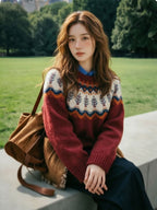 The Alpine Meadow burgundy knit sweater with ivory and navy Nordic-inspired patterned yoke and long sleeves