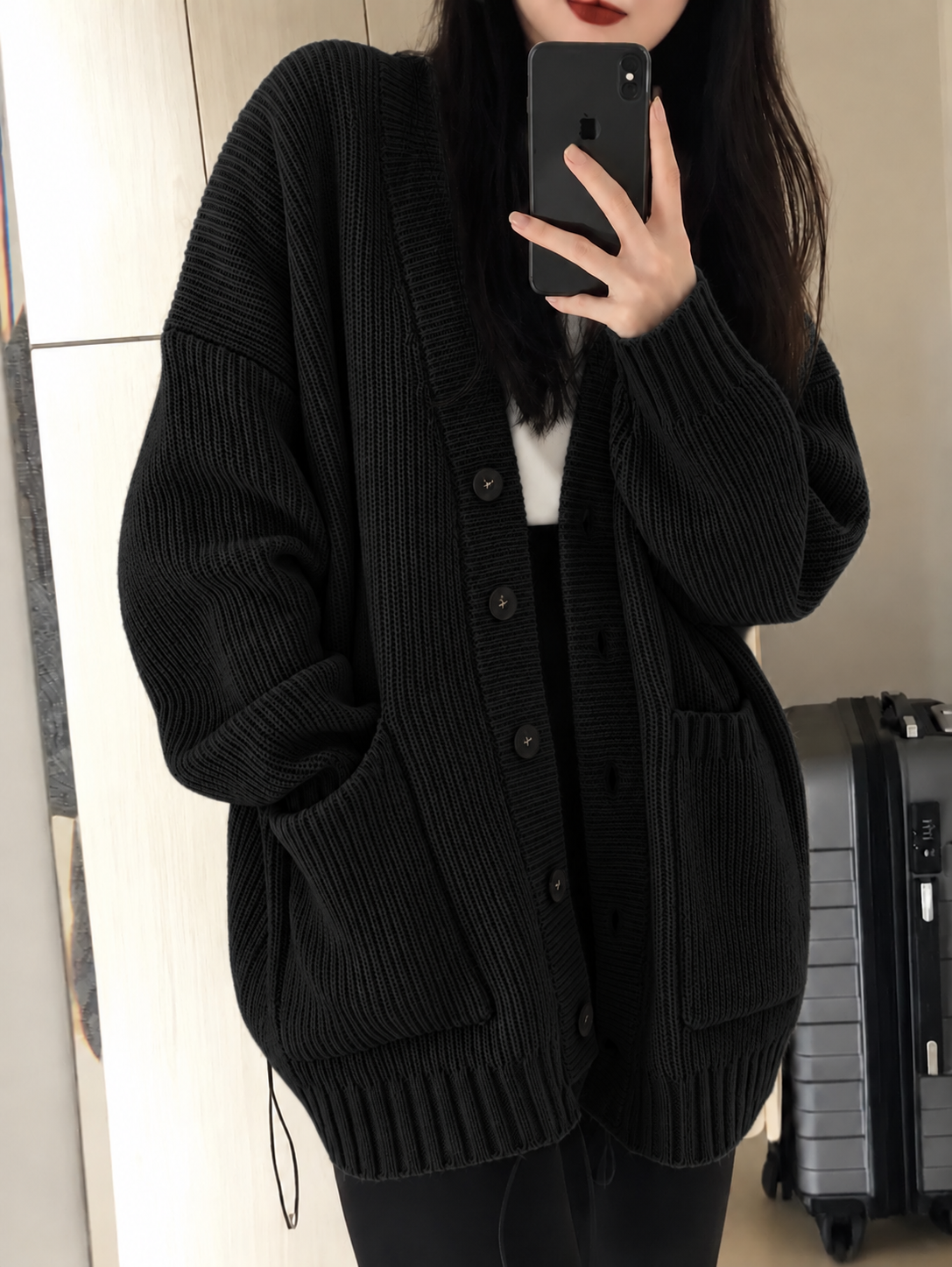 The Cozy Haven midnight black oversized ribbed cardigan with button closure and front pockets