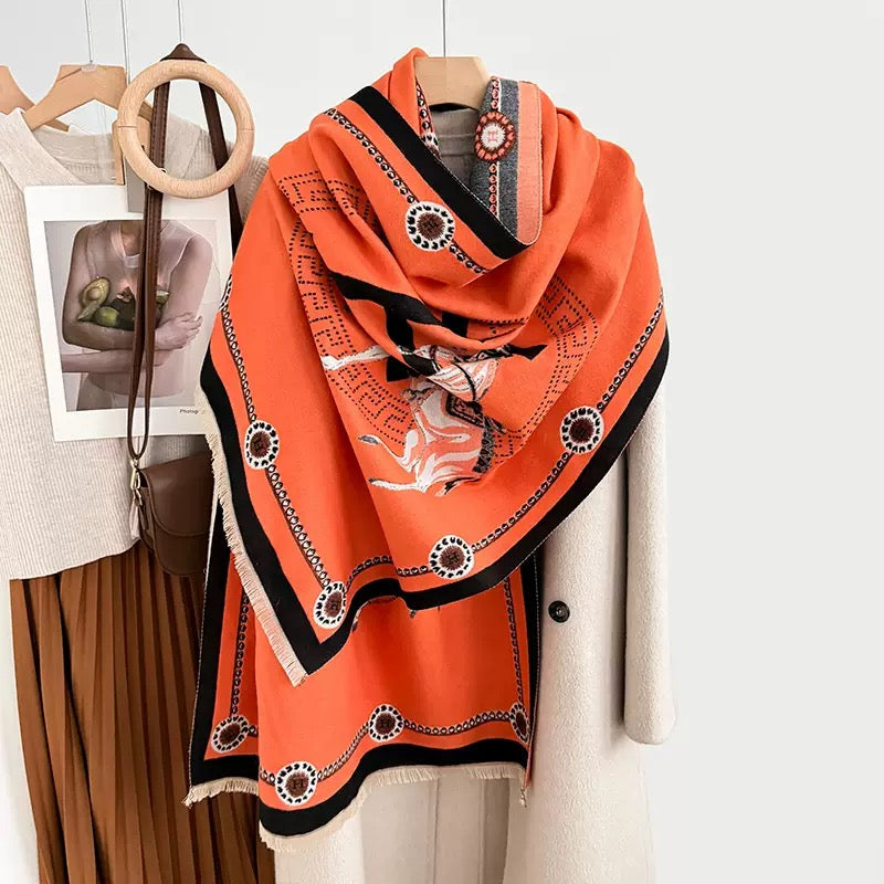     The Equestrian Royale Knit Wrap in orange faux cashmere with horse print and luxury border.