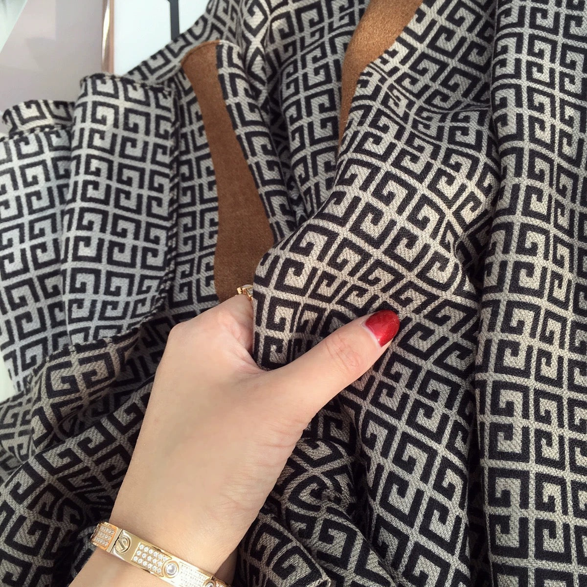Close-up of Urban Maze Cotton Stole showcasing the premium viscose cotton texture, Greek key geometric print, and camel-brown border detailing.