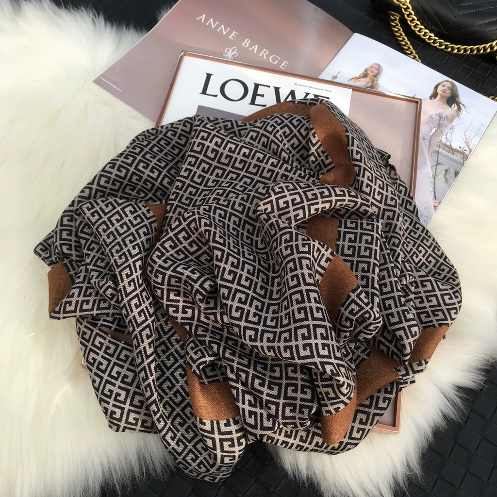 Flat lay of Urban Maze Cotton Stole featuring a black and beige Greek key pattern with camel-brown border in soft viscose cotton fabric.