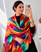 Premium imitation silk stole for women in a vibrant multicolor abstract feather print, elegantly draped over the shoulders. Lightweight rainbow scarf with a glossy silk finish by Westery Fashion.  
