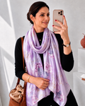 Lavender Magnolia luxury silk scarf by Westery cascading elegantly wrapped around a models neck showcasing its premium satin luster and fluid, graceful drape.