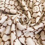 Detailed view of the fabric folds on the Westery Moroccan Lattice Luxe premium stole, highlighting the lightweight drape, high-quality printing, and sophisticated neutral colorway.
