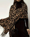 The Wild Elegance Winter Wrap showing full bold wild animal print in refined tonal shades on soft faux cashmere fabric
