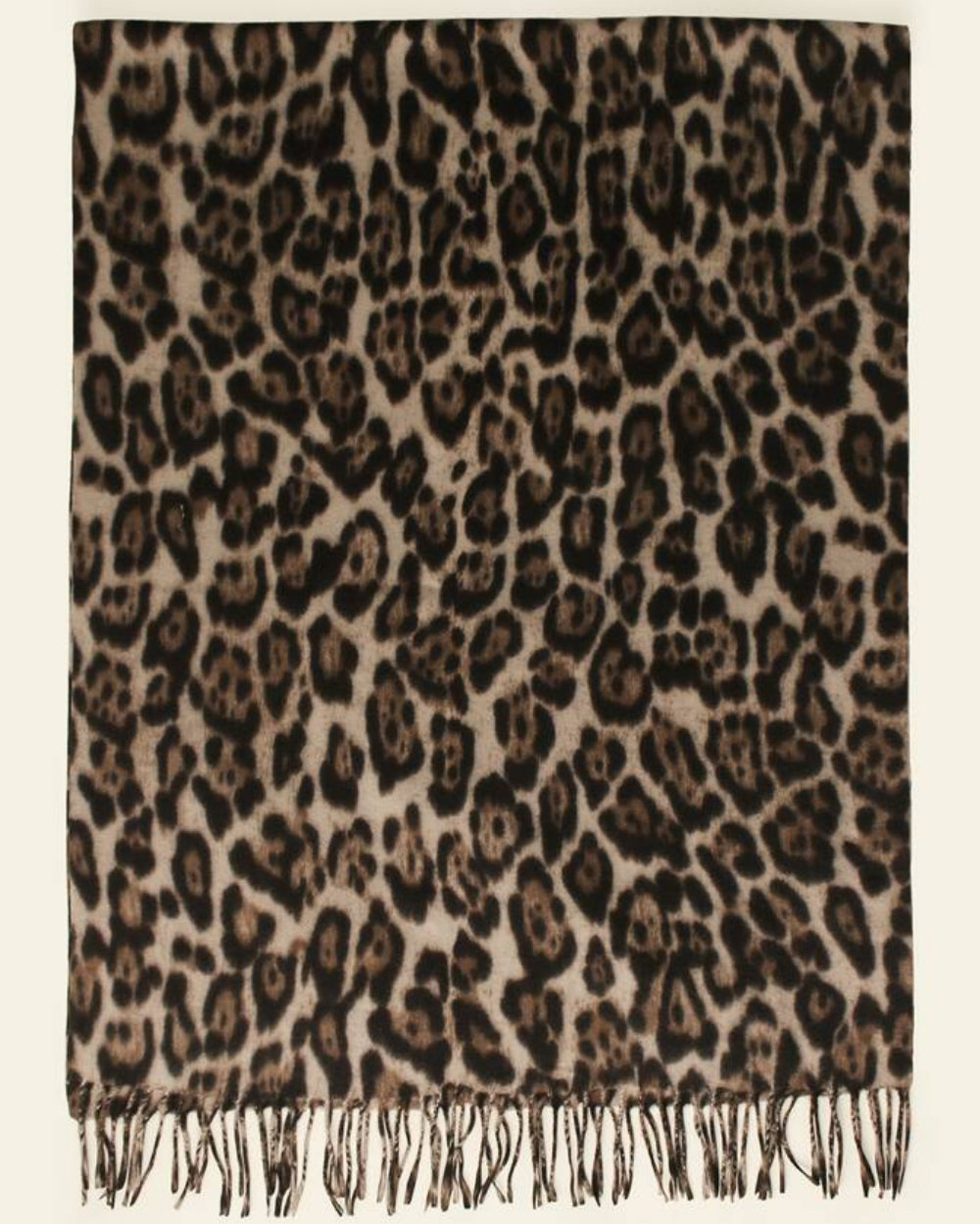 The Wild Elegance Winter Wrap draped and styled showing refined wild animal print on premium faux cashmere winter wrap
