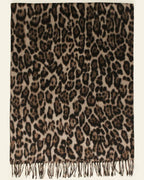 The Wild Elegance Winter Wrap draped and styled showing refined wild animal print on premium faux cashmere winter wrap
