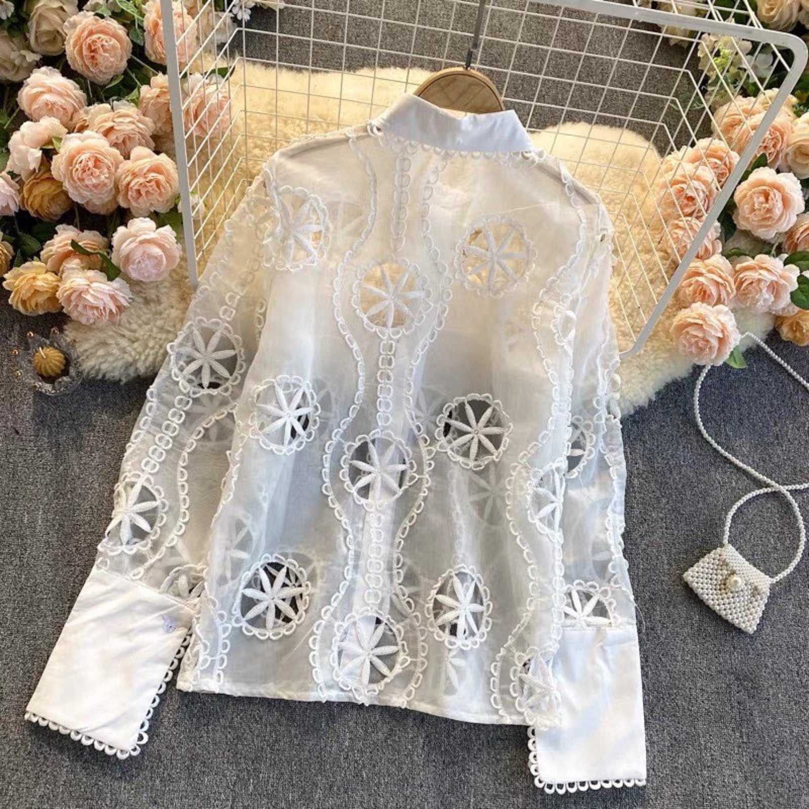 Back view of Vibe Eyelet Statement Shirt showing crochet lotus eyelet detailing and sleeve pattern